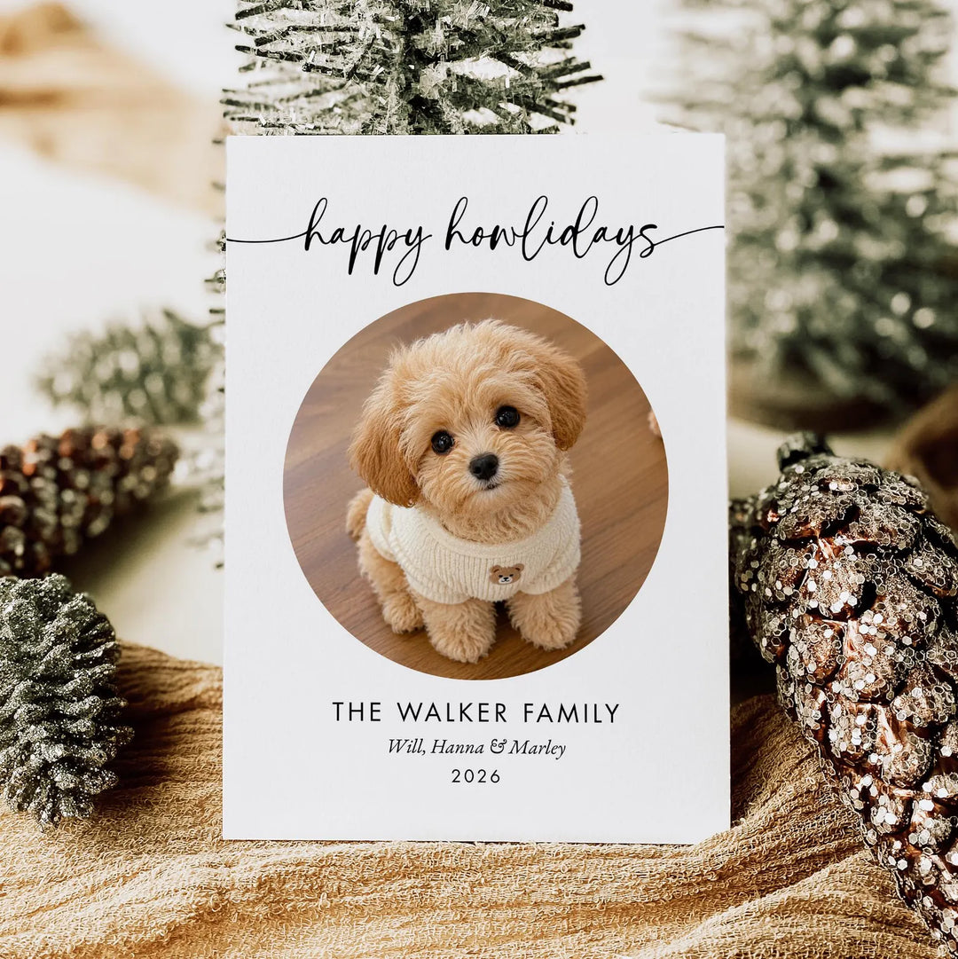 Happy Howlidays dog Christmas card with round pet photo held in front of a Christmas tree