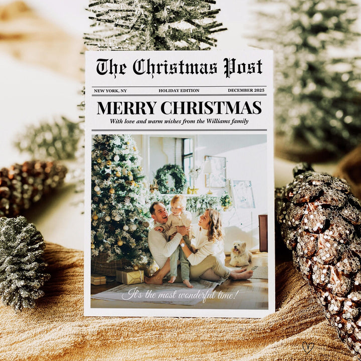 Newspaper Christmas photo card with The Christmas Post masthead and a large family photo, styled with miniature Christmas trees.