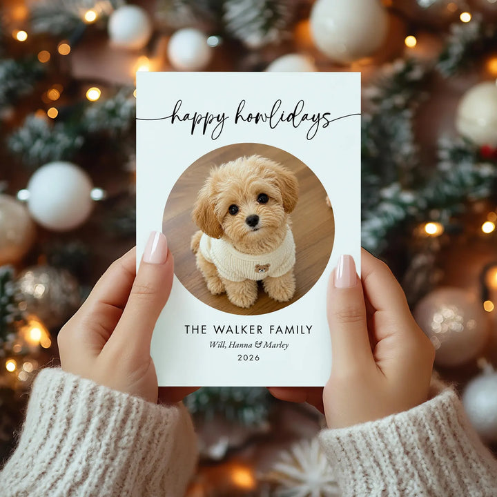 Dog Christmas card held over twinkling holiday lights
