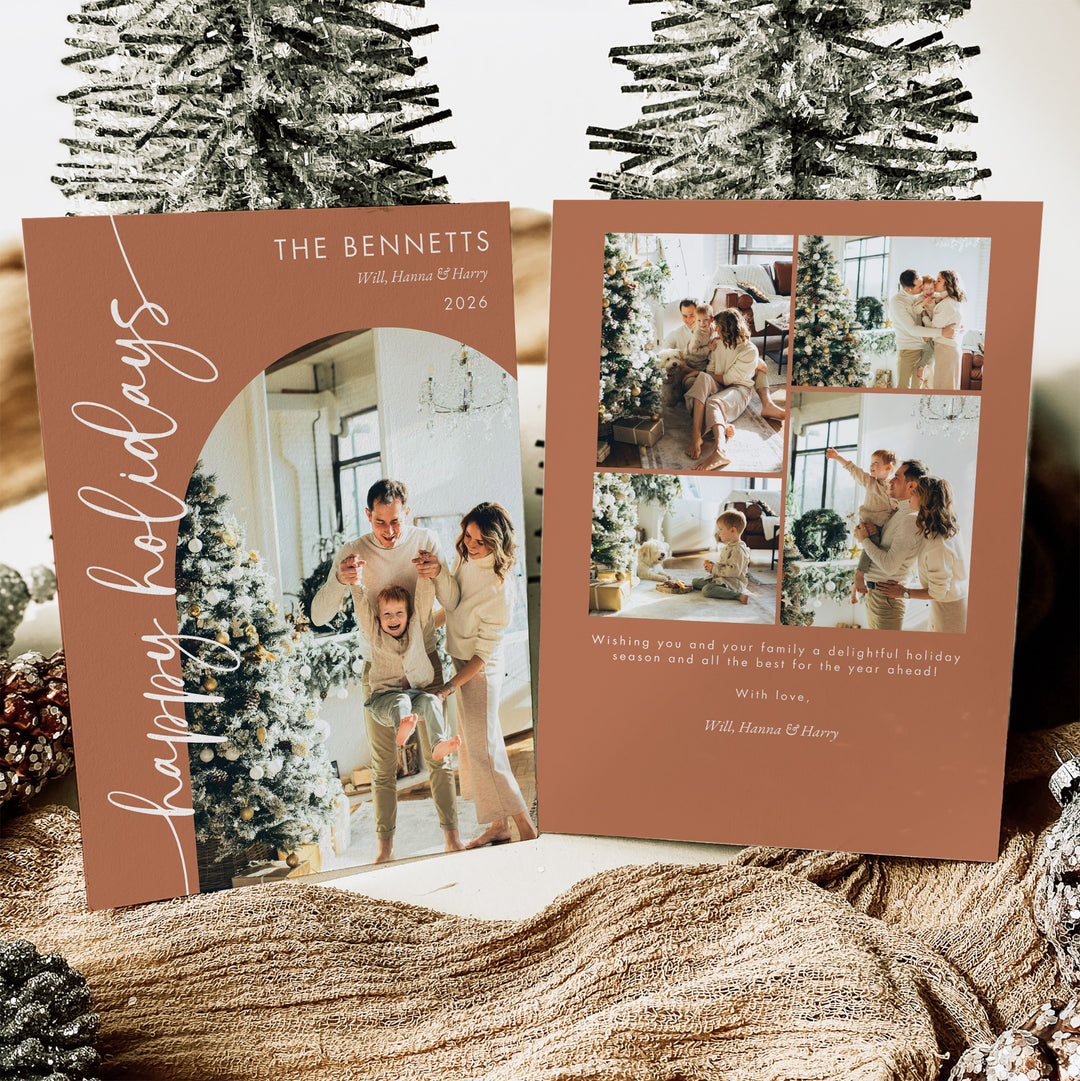 Front and back of a terracotta Happy Holidays photo card with an arched family portrait and four-photo collage.